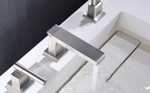 Neutral bathroom tiles with matching sanitaryware and fittings